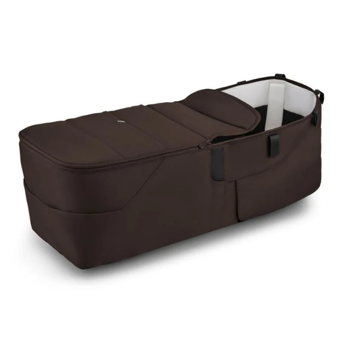 Brown baby bassinet on a white background