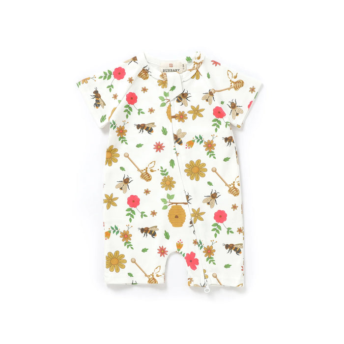 Baby romper with floral and bee pattern on a white background