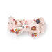 Pink bow with cartoon character design on a white background