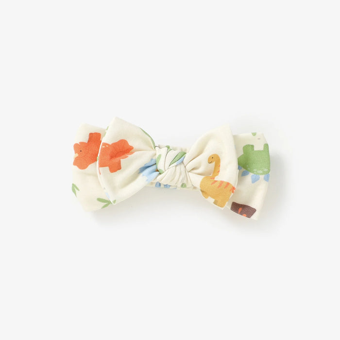 Bow tie with dinosaur pattern on a white background