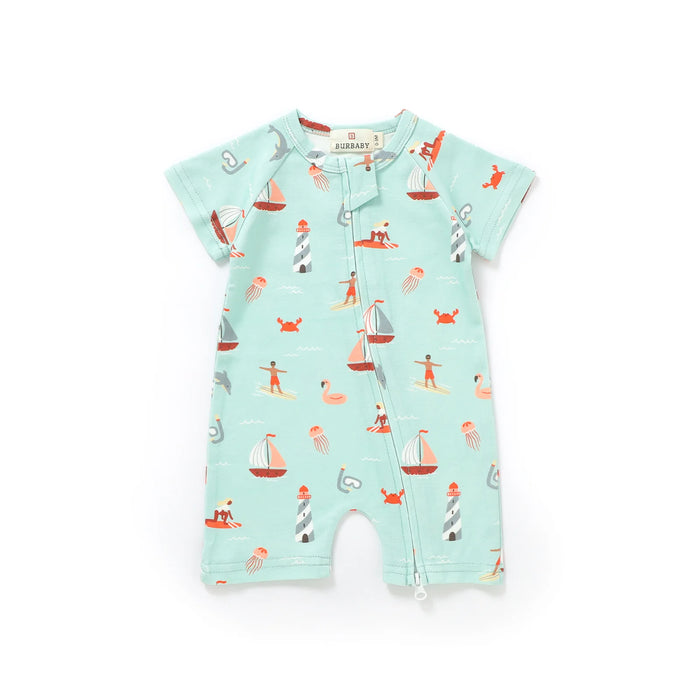 Baby romper with nautical pattern on a light blue background
