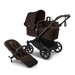 Brown and black stroller with pram and stroller seat on a white background