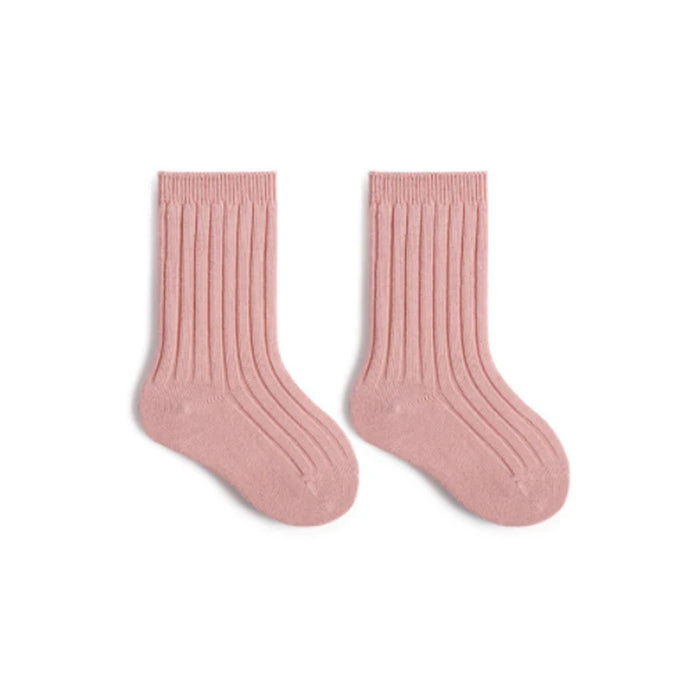 Pair of pink socks on a white background