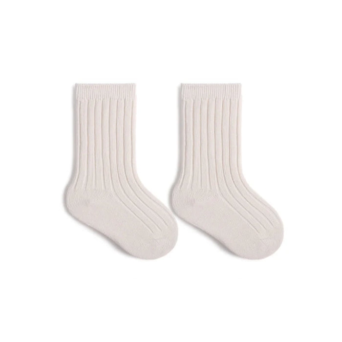 Pair of white socks on a white background