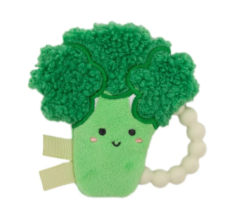 Plush broccoli toy with a smiling face on a white background