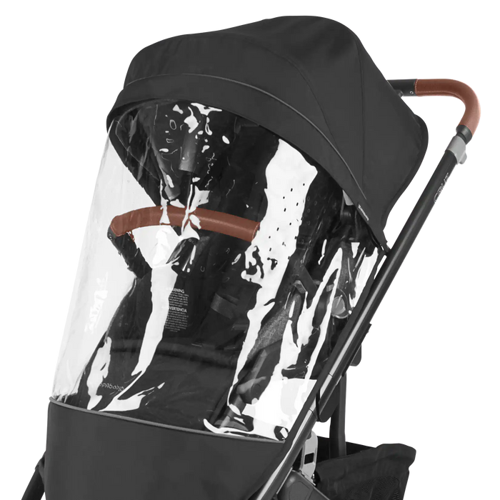 Black UPPAbaby stroller with clear rain cover on a white background