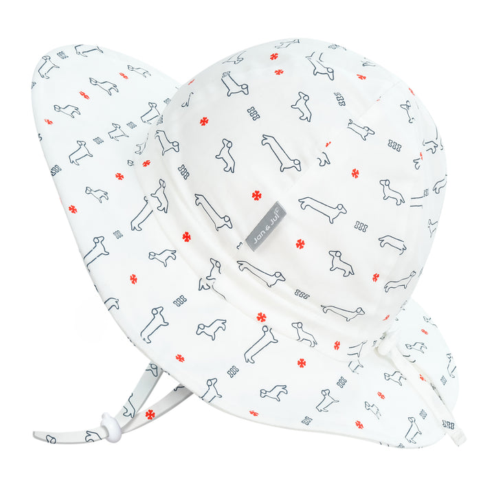 A sun hat with dog pattern on a white background