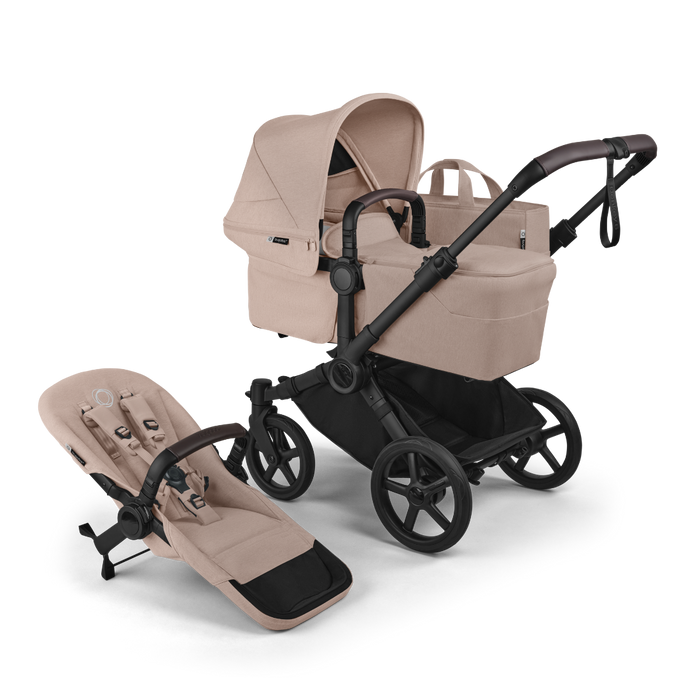 Beige and black stroller with accessories set on a white background