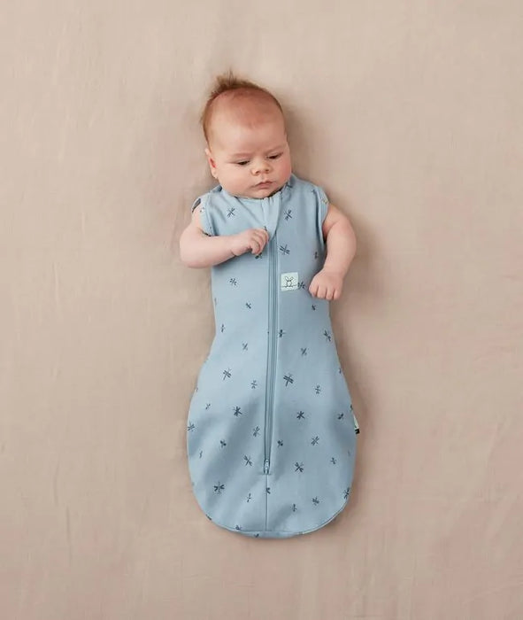 caption-Baby wearing Ergo Cocoon with arms out