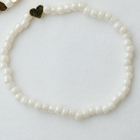 Ivory beaded bracelet with a 14k gold plated heart bead