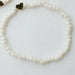 Ivory beaded bracelet with a 14k gold plated heart bead