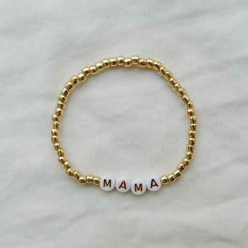 beaded bracelet with MAMA spelled out against a white background