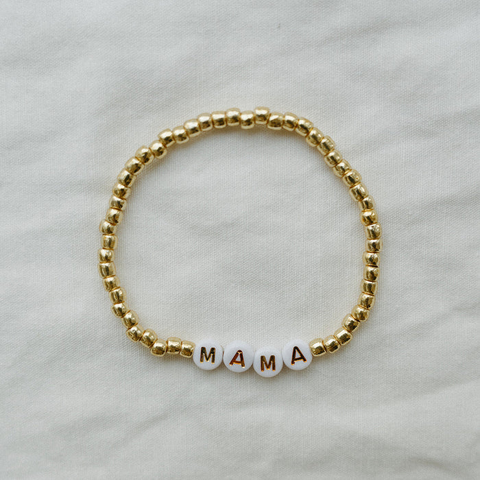 beaded bracelet with MAMA spelled out against a white background
