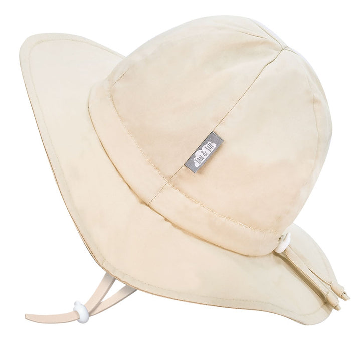 Beige sun hat with a label on a white background