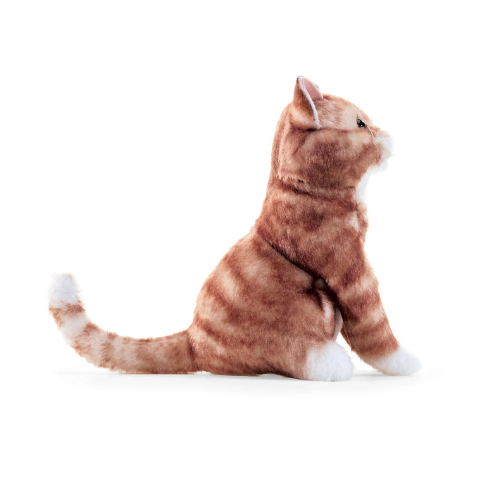 Plush toy finger puppet cat sitting on a white background