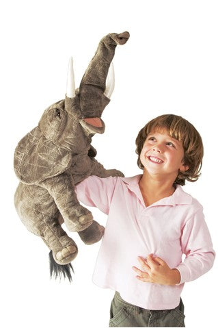 caption-Child plays with Elephant Puppet