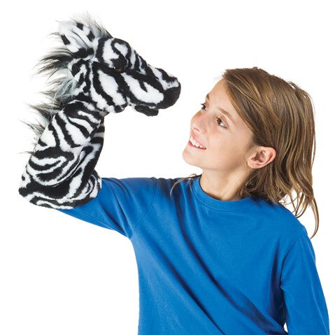 caption-Child plays with Zebra Puppet on her arm