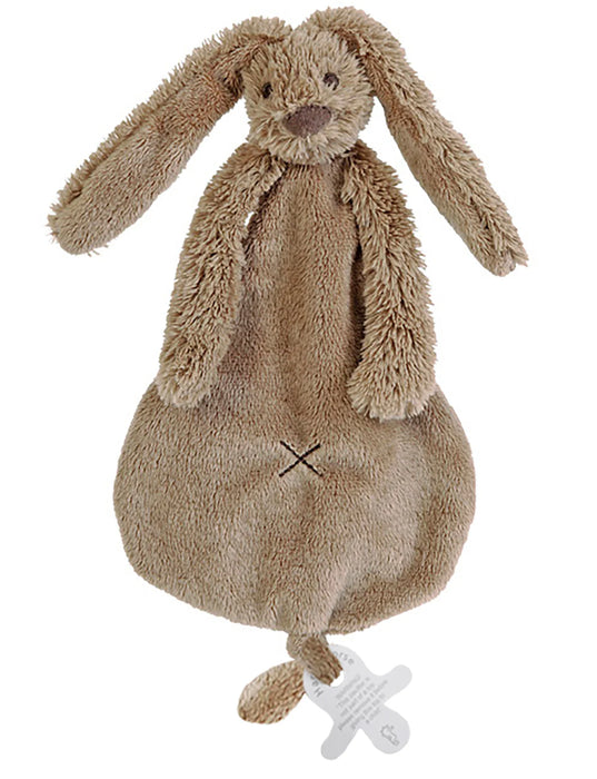 Plush toy rabbit with a pacifier on a white background