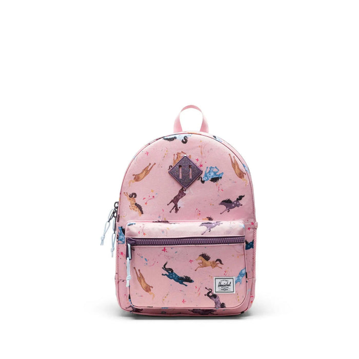 Pink backpack with fairy pattern on a white background