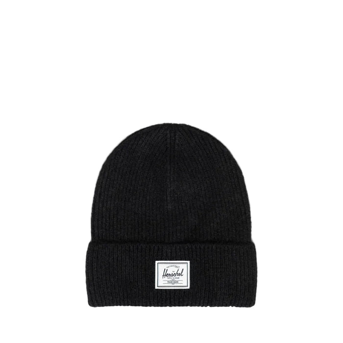 A black ribbed knit beanie hat with a folded cuff, featuring a small white rectangular Herschel brand patch on the front, set against a white background
