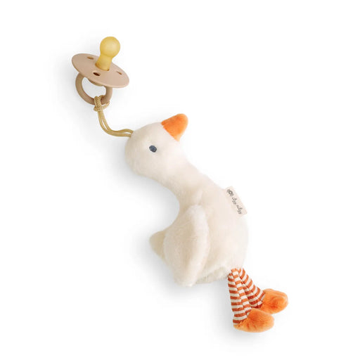 Plush toy goose with a pacifier on a white background