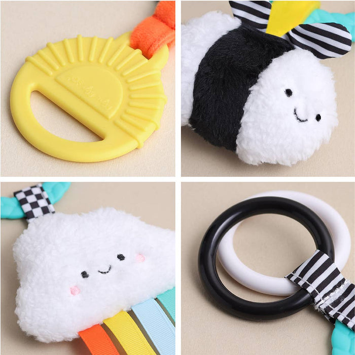 Four colorful baby toys on a beige background