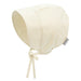 Beige striped baby bonnet with a bow on a white background