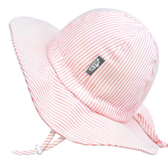 Pink and white striped sun hat with a brand label on a white background