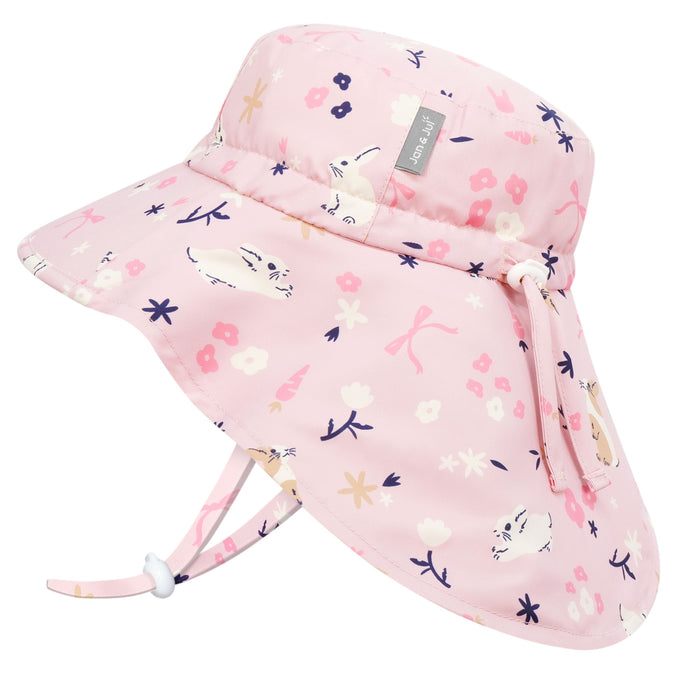 Pink children's sun hat with floral and cat pattern on a white background