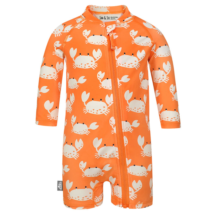 Orange baby romper with crab pattern on a white background