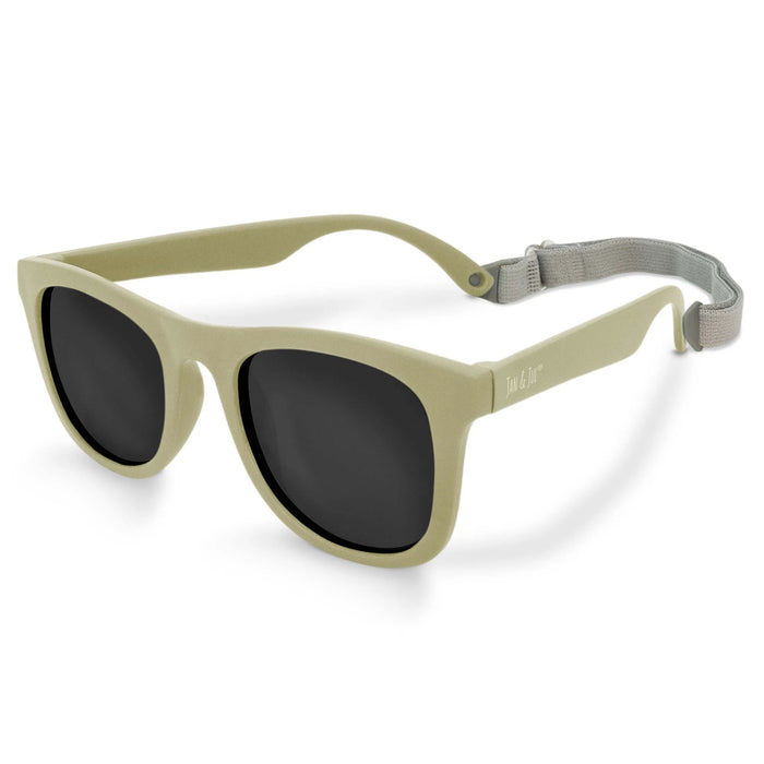 Beige sunglasses with dark lenses on a white background