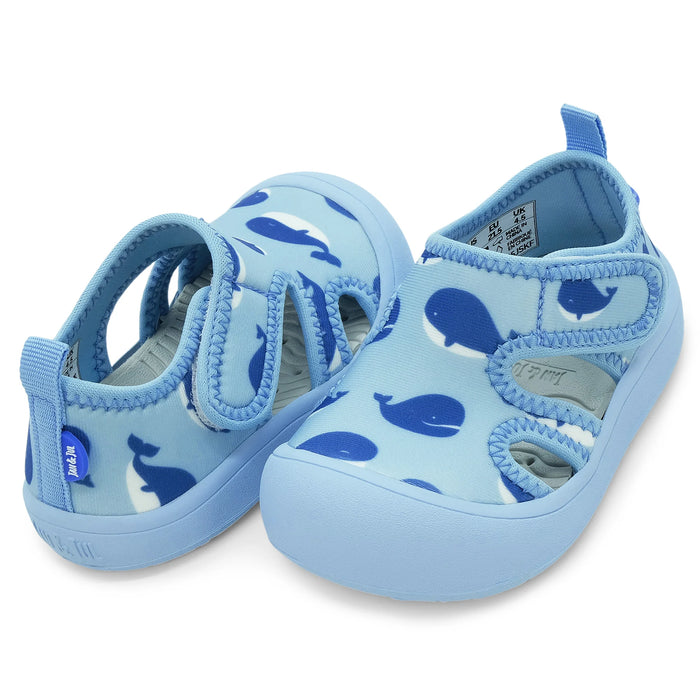 Light blue children's sandals with whale pattern on a white background
