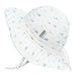 Two baby sun hats with whale pattern on a white background