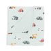 Folded blanket with vehicle pattern on a white background