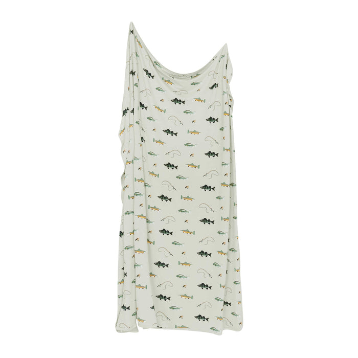 White blanket with fish pattern on a white background