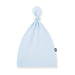 Light blue baby hat with a knot on top against a white background