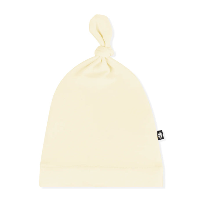 Beige beanie with a brand logo on a white background