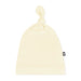 Beige beanie with a brand logo on a white background
