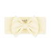 Cream-colored headband with a large bow on a white background, branded 'Kyte Baby'.