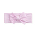 Pink headband with a large bow on a white background