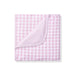 Pink and white checkered blanket on a white background