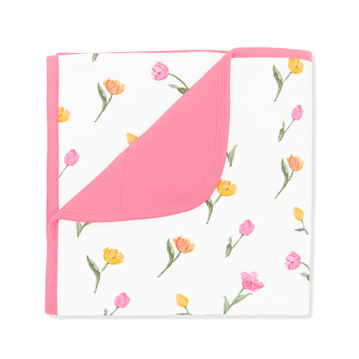 Floral-patterned blanket with pink border on a white background