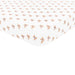 Pattern of small cartoon characters on a crib sheet on a white background 