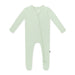 Light green baby onesie on a white background