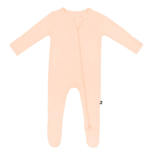 Peach pink baby sleeper with a double zipper featured on a white background