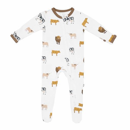 Baby onesie with cow pattern on a white background