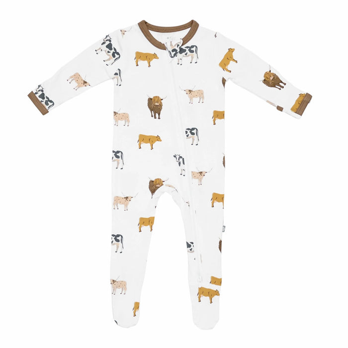 Baby onesie with cow pattern on a white background