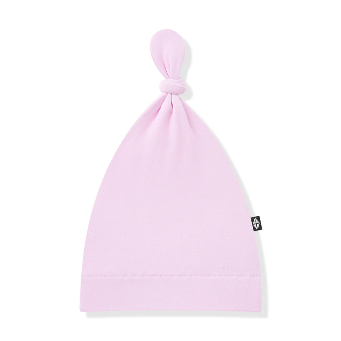 Pink baby hat with a brand logo on a white background