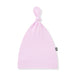 Pink baby hat with a brand logo on a white background