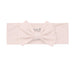 Pink headband with a bow on a white background